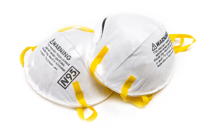Image of two white, N95 face masks displaying a warning message about proper fit