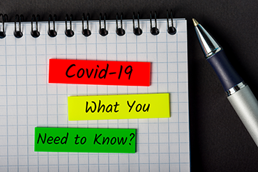 Imae of a pen and notepad with the words, Covid-19 What You Need to Know?