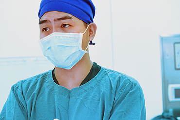 Asian American hospital worker wearing facemask