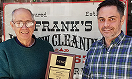 Richard Kulzer and Rick Kulzer holding plaque recognizing Frank's Window Cleaning for 75 years as a NYSIF customer